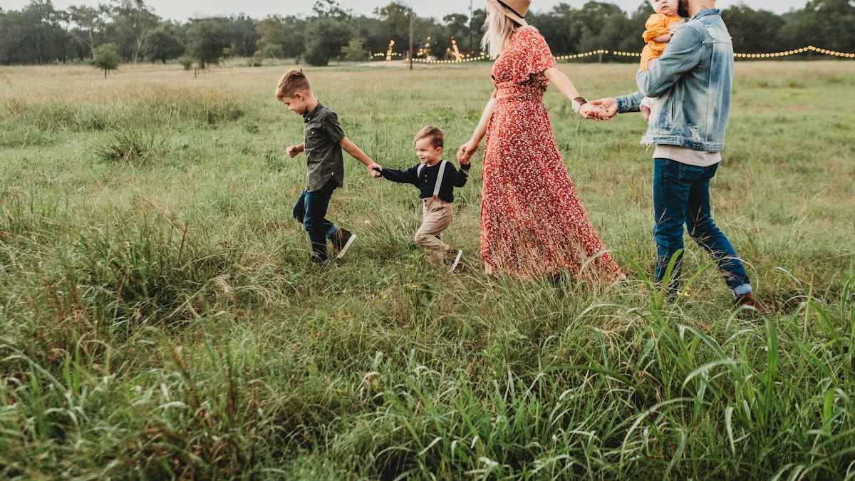 A young family walking together outdoors