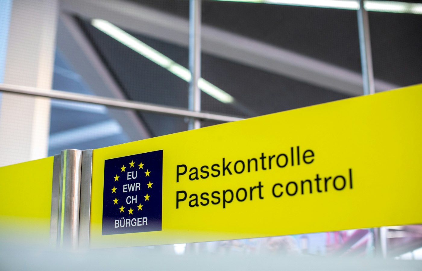 A passport control sign at a European airport