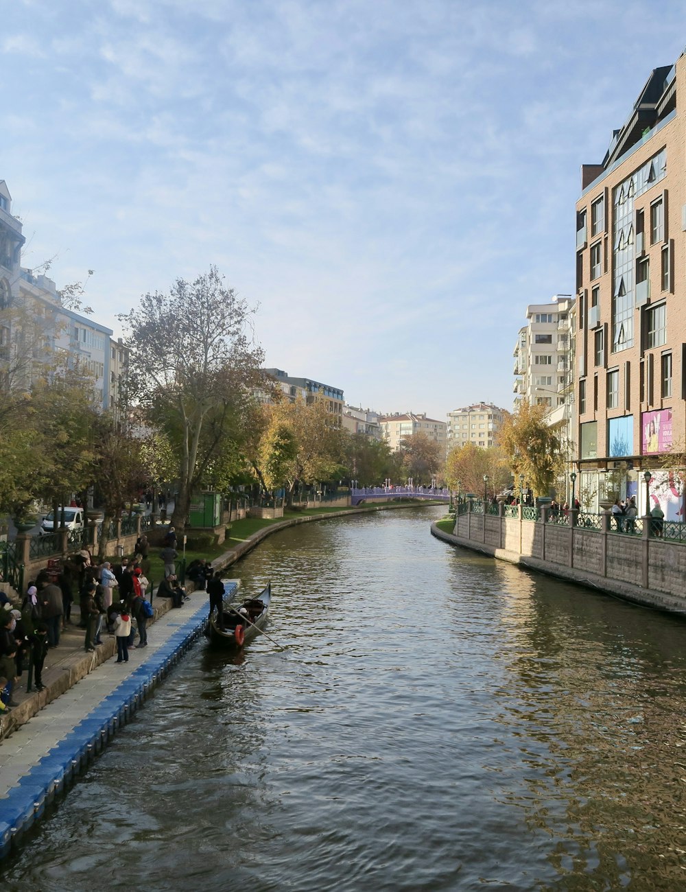 People walking beside the canal in Eskisehir, a Turkish student city