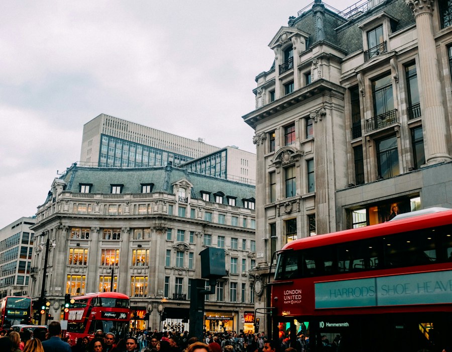 A red London bus on a busy street in central London