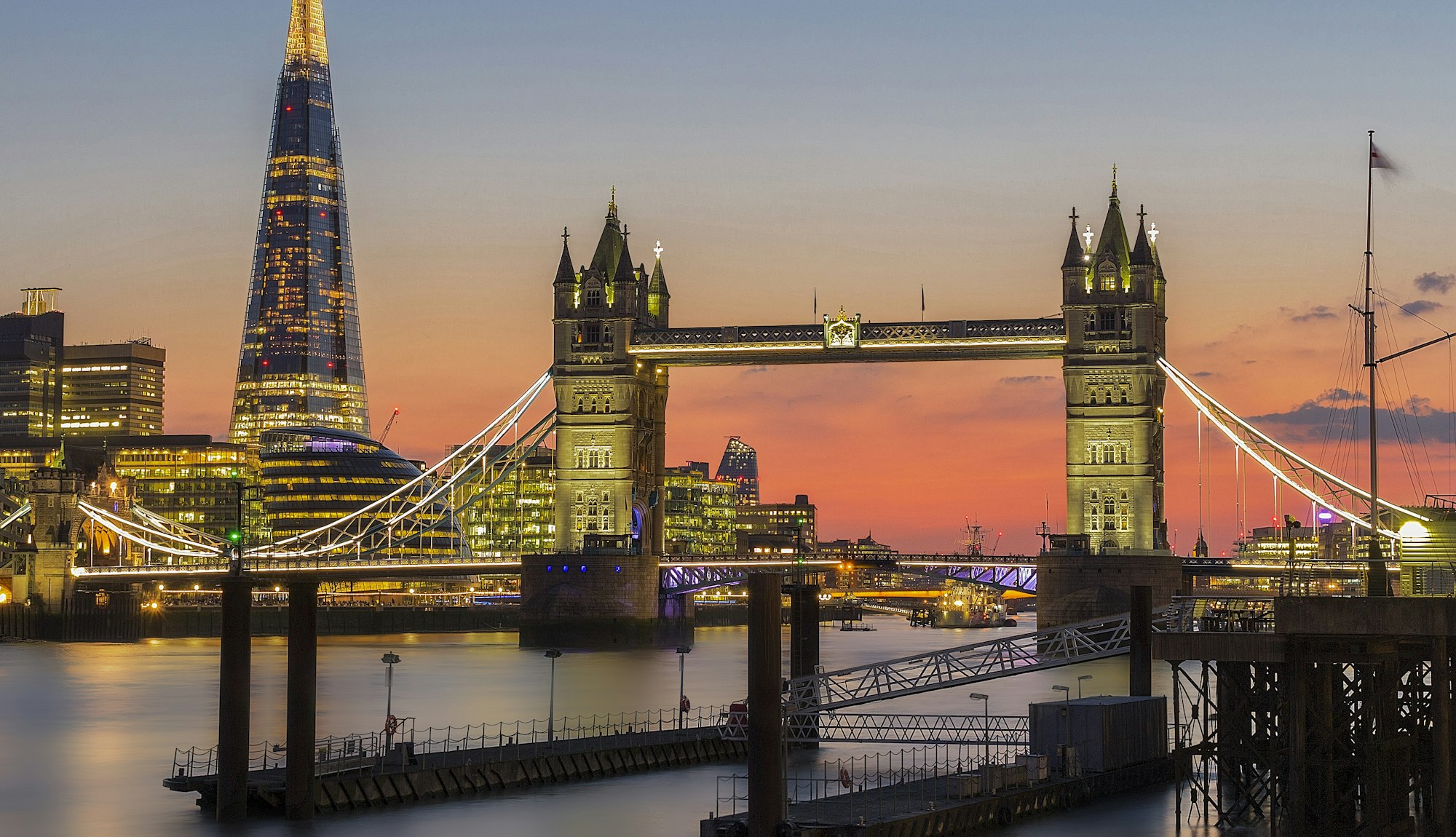 Tower Bridge and the Shard lit up at sunset in London