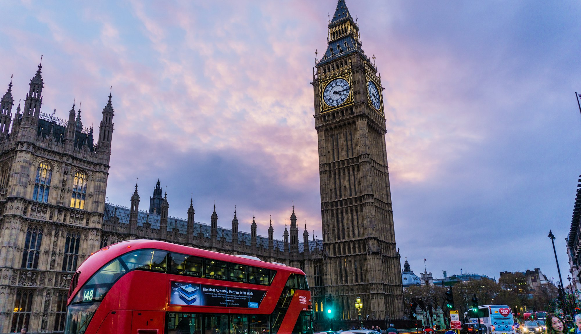 Big Ben and a red double decker bus in Westminster, London