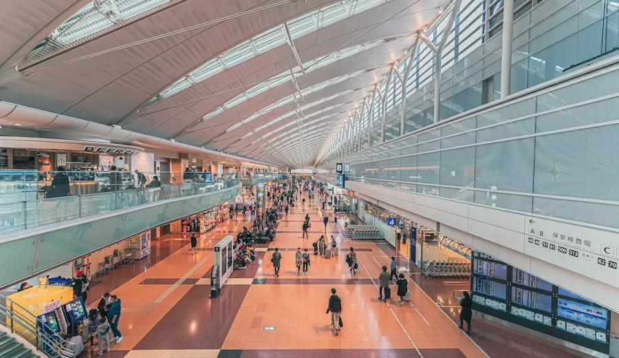 Travellers walking through an airport terminal